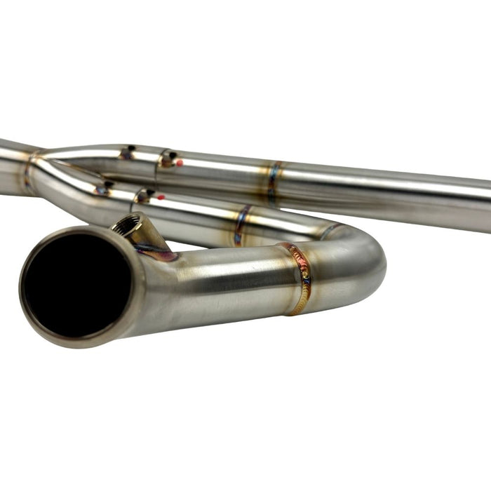 TC Bros. 2-into-1 Stainless Exhaust System for 2018-Up Harley-Davidson Softail by TC Bros., displayed with various Harley-Davidson Softail exhaust pipes in the background.