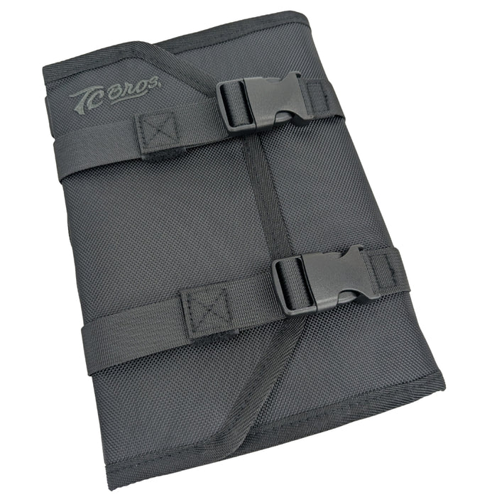 A black and red TC Bros. Tool Roll, weather-resistant with compartments holding various tools; text at bottom states "TOOLS NOT INCLUDED.