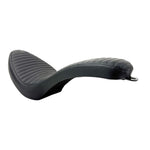 Two black motorcycle seats from Sully's Customs—a hardtail saddle with horizontal stitching and the Cobra Seat for Hardtail with a diamond quilted design—are shown from above, each built on a sturdy steel pan.