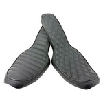 Two black, padded Sully's Customs Cobra Seats for 1996-2003 Harley-Davidson Dyna, featuring a quilted diamond pattern, are shown overlapping on a white background.