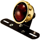 The Mid-USA Vintage Drilled Tail Light features a round design with a red lens and aluminum housing in silver, black, or gold. Each mounts on a black bracket with two screw holes and works with a 12V dual-filament bulb for reliable performance.