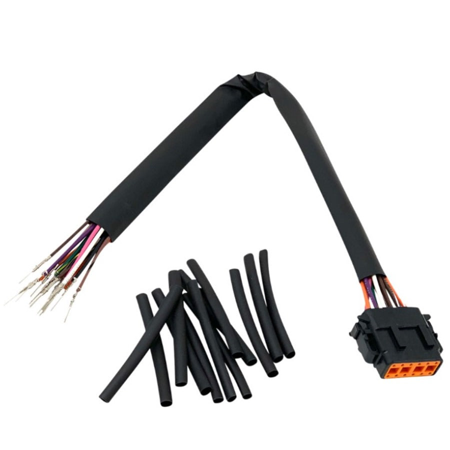 A cut Namz Speedometer & Instrument Extension Harness - 15" for '99-'06 FXD Sportster Models with exposed wires and plastic connectors, alongside heat shrink tubing.