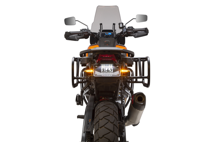 Close-up of a Harley-Davidson Pan America equipped with a Yoshimura Fender Eliminator Kit, featuring the taillight, license plate holder with “Yoshimura” branding, and dual round signal lights.