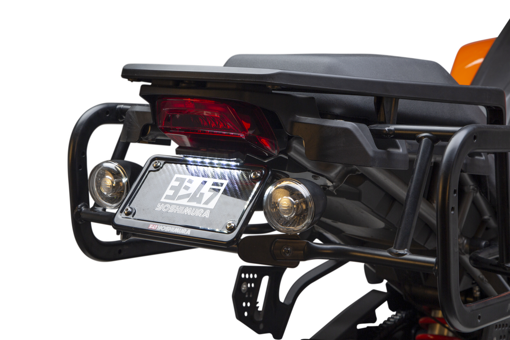 Close-up of a Harley-Davidson Pan America equipped with a Yoshimura Fender Eliminator Kit, featuring the taillight, license plate holder with “Yoshimura” branding, and dual round signal lights.