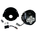 The Shark Demon™ 2 Performance LED Headlight Kit by Custom Dynamics is a round, black, DOT compliant headlight with an attached wiring harness and connectors. It also includes a separate mounting bracket with screws and rubber grommets, making it perfect for those seeking a reliable upgrade for their '22-'24 Harley Low Rider ST.
