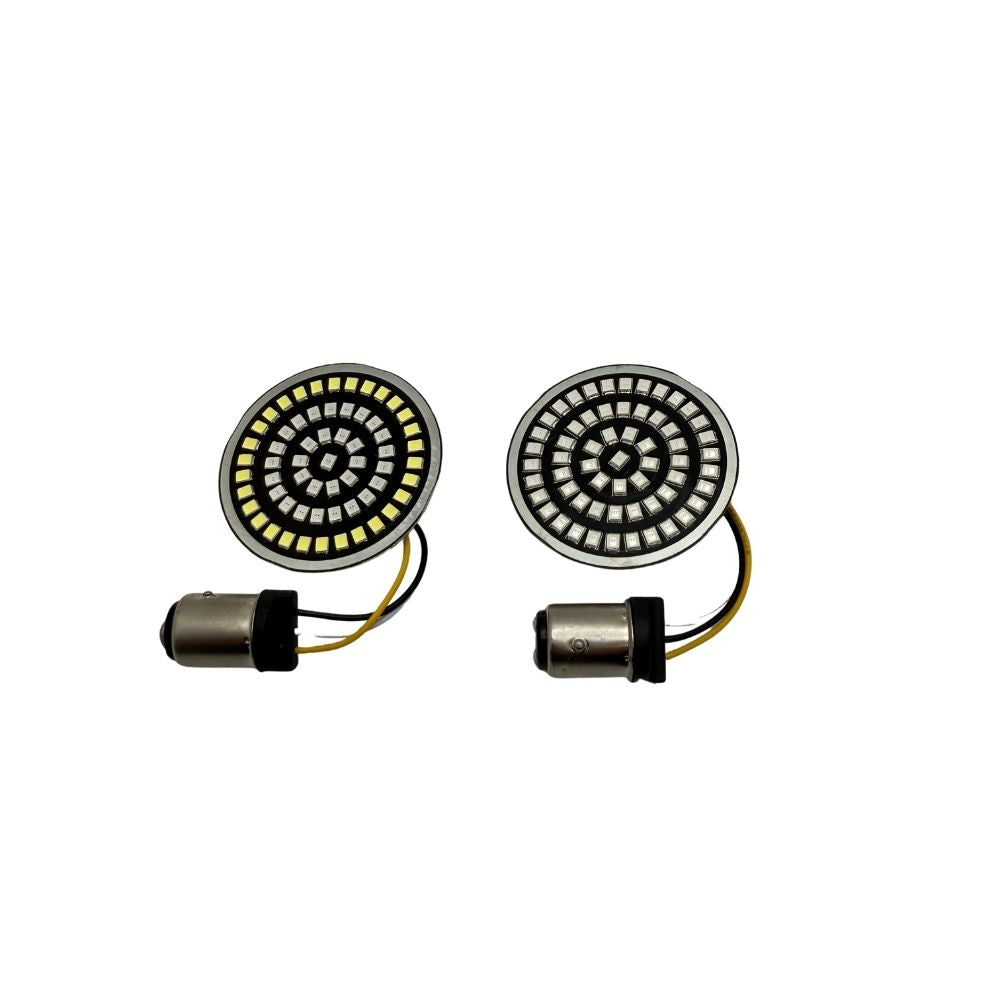 A Moto Iron® LED Turn Signal Conversion Kit for 2000-2024 Harley-Davidson bikes, featuring round modules, black and white covers, adapters, and mounting plates—neatly arranged in rows on a white background.