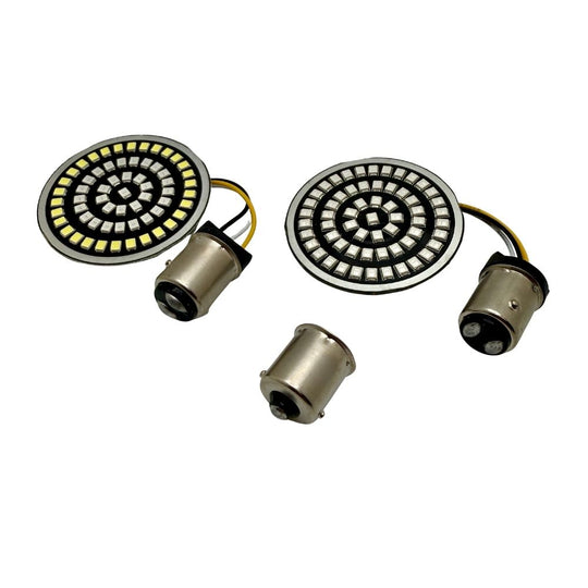 A Moto Iron® LED Turn Signal Conversion Kit for 2000-2024 Harley-Davidson bikes, featuring round modules, black and white covers, adapters, and mounting plates—neatly arranged in rows on a white background.