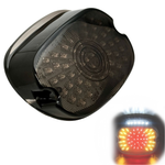 The Moto Iron® LED Laydown Squareback Light for 1973-1998 Harley-Davidson offers a circular pattern, shown unlit and illuminated in red, yellow, and white, with integrated turn signals for enhanced visibility.