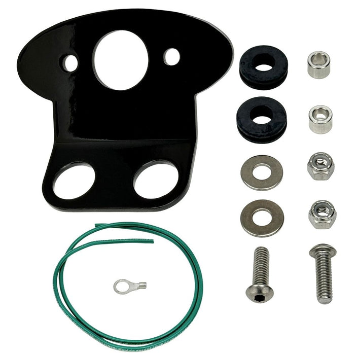 The TC Bros. Tail Light Bracket Conversion Kit includes a metal license plate bracket, green wire with ring terminal, two black rubber grommets, washers, bolts, and nuts—all from TC Bros.—arranged on a white background.