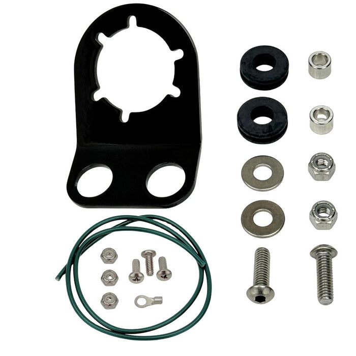 The TC Bros. Tail Light Bracket Conversion Kit includes a metal license plate bracket, green wire with ring terminal, two black rubber grommets, washers, bolts, and nuts—all from TC Bros.—arranged on a white background.