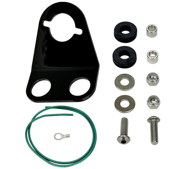 The TC Bros. Tail Light Bracket Conversion Kit includes a metal license plate bracket, green wire with ring terminal, two black rubber grommets, washers, bolts, and nuts—all from TC Bros.—arranged on a white background.
