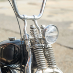 The Prism Supply 4-1/2" Round LED Headlight by Prism Supply features a chrome-plated, weather-resistant housing and a clear ribbed glass lens, shown here on a white background.