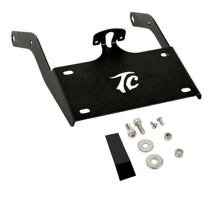 TC Bros. License Plate Relocation Bracket for 2022-Up Harley-Davidson Nightster RH975, with logo, includes screws, washers, nuts, bolt, and a black rectangular piece—all neatly arranged on a white background.