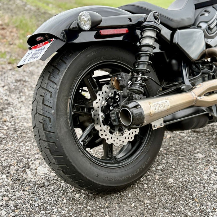 TC Bros. License Plate Relocation Bracket for 2022-Up Harley-Davidson Nightster RH975, with logo, includes screws, washers, nuts, bolt, and a black rectangular piece—all neatly arranged on a white background.