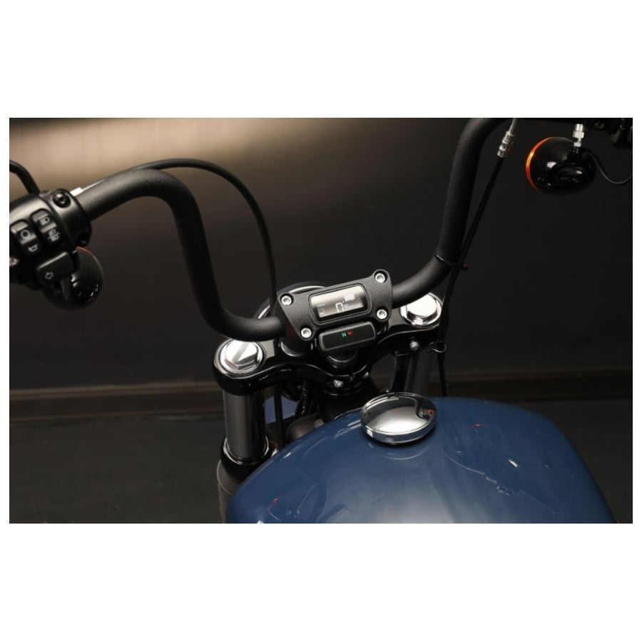 The Koso D2 Heads-Up Display for Harley '04-'11 FX, '04-'13 FL, and '04-'13 XL models shows a speed of 99 km/h with various dashboard indicators and icons illuminated below, featuring a multifunction meter for enhanced riding information.