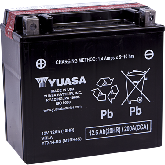 Three Yuasa YTX14/YTX14L batteries, including two black sealed AGM batteries in the foreground, and one electrolyte container with visible warning labels in the background.