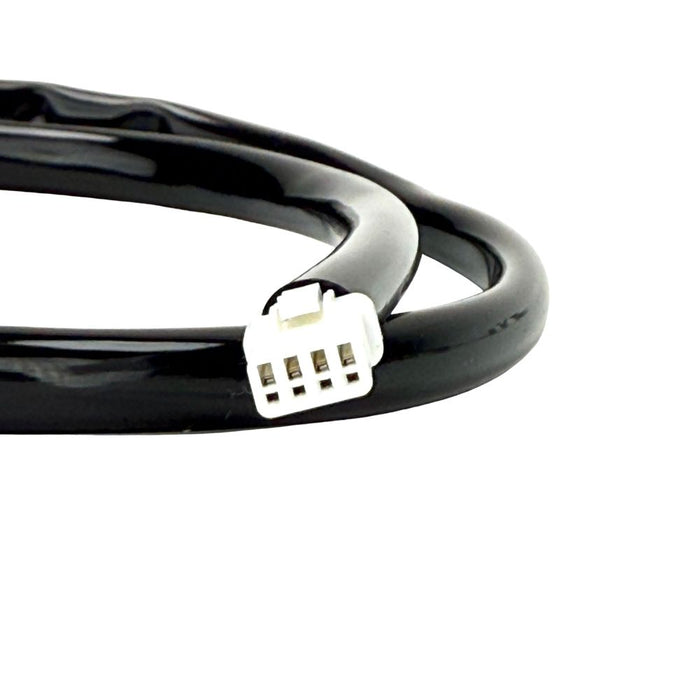 The Namz 15" Speedometer Extension/Conversion Harness for 2018-2024 Harley-Davidson Softail features a black cable with a rectangular green and black connector on one end and a small white connector on the other, coiled in a loop.