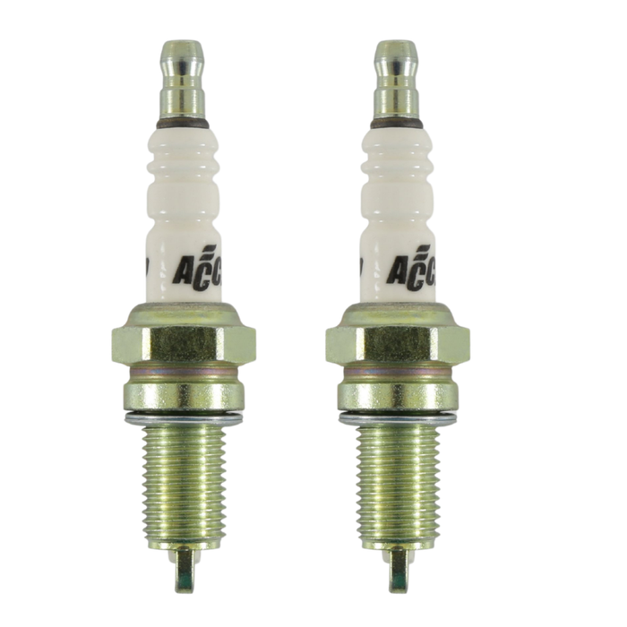 Four identical Accel Spark Plugs for Harley-Davidson Twin Cam and Sportster Evolution, by Accel, are arranged against a white background in two vertical columns and two rows, each positioned at varying angles.