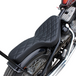 Two black, ribbed TC Bros. Cobra Hardtail Seats are shown, one installed on a motorcycle—ideal for Sportster hardtails or anyone wanting the classic look of a TC Bros. Cobra chopper seat.