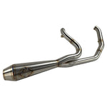The SP Concepts Lane Splitter Exhaust for M8 Softail w/o Factory Bags—Stainless, features a 2-into-1 design, visible welds, and brand logo emblem, displayed on a workshop surface.
