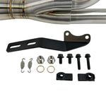 The SP Concepts Big Bore Exhaust M8 Softail 2018-Present - Stainless features polished stainless steel with visible welds and an engraved logo, designed for Monoshock Softail models, and is displayed on a gray work surface.