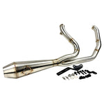 The SP Concepts Big Bore Exhaust for M8 Softail ST & Sport Glide (2018-Present) in stainless steel, featuring welded joints and a hexagonal logo emblem, rests on a metallic work surface, highlighting its premium finish.