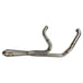The SP Concepts Lane Splitter Exhaust for Harley Touring 2017-2025 – Stainless, with visible welds, sits on a workbench beside an American flag welding helmet—ready to upgrade your ride in style.