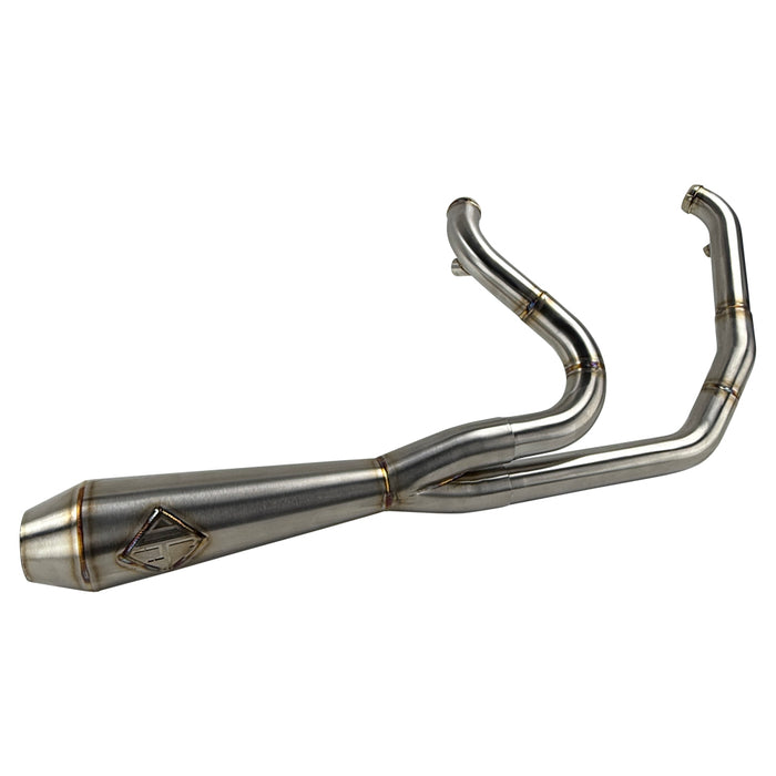 The SP Concepts Lane Splitter Exhaust for 2006-2017 Harley-Davidson Dyna features visible welds and a hexagonal logo plate, showcased on a workshop table.