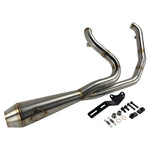 The SP Concepts Lane Splitter Exhaust for 2006-2017 Harley-Davidson Dyna features visible welds and a hexagonal logo plate, showcased on a workshop table.