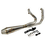 An SP Concepts Big Bore Exhaust 06-17 Dyna (stainless) motorcycle parked in a garage.