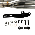 An SP Concepts Big Bore Exhaust 06-17 Dyna (stainless) motorcycle parked in a garage.