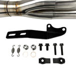 An SP Concepts Big Bore Exhaust 06-17 Dyna (stainless) motorcycle parked in a garage.