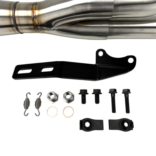 An SP Concepts Big Bore Exhaust 06-17 Dyna (stainless) motorcycle parked in a garage.