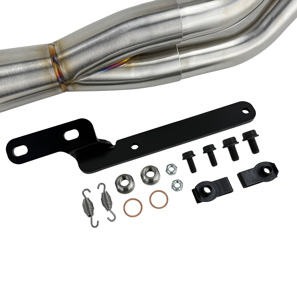 An SP Concepts Lane Splitter Exhaust Sportster 2014-2022 (stainless) motorcycle is parked in a garage.