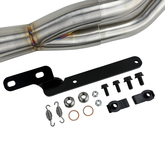 An SP Concepts Lane Splitter Exhaust Sportster 2014-2022 (stainless) motorcycle is parked in a garage.