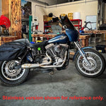 A SP Concepts Lane Splitter Exhaust Dyna 1999-2005 (Black) is sitting on a table.