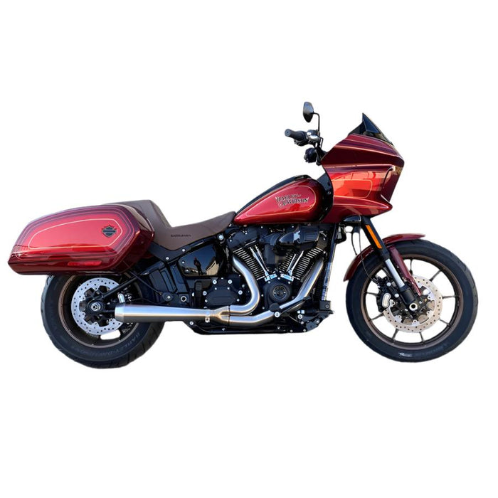 A red motorcycle with a Bassani Road Rage III 2-into-1 Stainless Exhaust 2018-21 FLSB, 2022-2024 FXL parked in front of a garage.