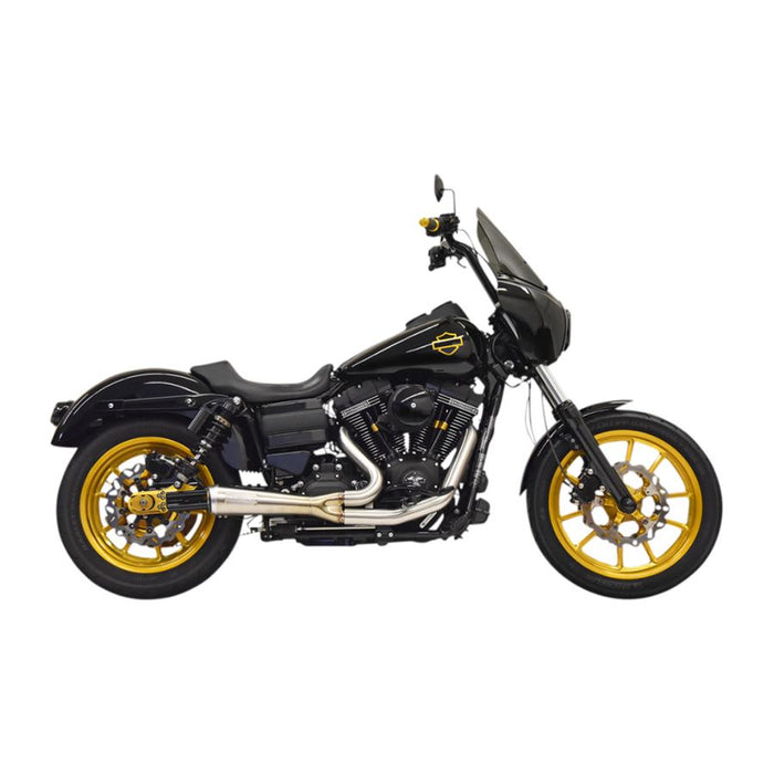 A black motorcycle with gold accents, featuring a windshield, large exhaust pipe, and spoke wheels fitted with a Bassani The Ripper Road Rage 2-into-1 Stainless Exhaust 06-17 FXD (w/Mids), 07-17 FXD/FXDWG (w/Forwards).