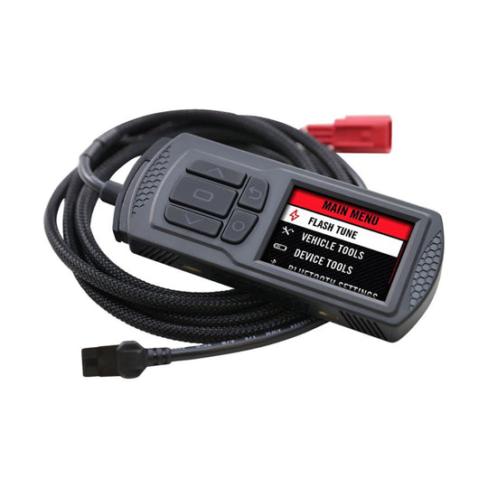 The Dynojet Power Vision 3 2021-2022 M8 Harley Softail/Touring MT22 ECU fuel tuner is a handheld electronic device with a screen displaying a menu and buttons for navigation, connected to a cable with a red plug, perfect for enhancing your Harley Softail's performance.