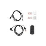 A set of Dynojet Power Vision 3 06-13 Touring, 06-10 Softail, 06-11 Dyna & 07-13 Sportster J1850 ECM cables and a remote control for a car, serving as fuel tuner to optimize the car&