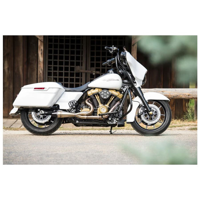 A Sawicki Speed motorcycle parked in front of a barn.