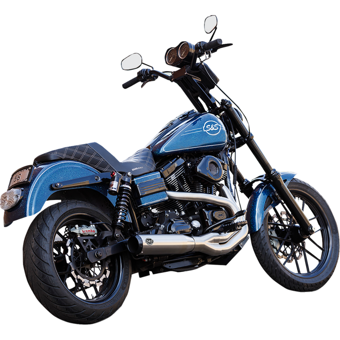 A blue and black cruiser with a V-twin engine, black seat, tall handlebars, and an S&S Cycle Qualifier 2-into-1 Exhaust System for 2006-2017 Harley-Davidson Dyna, viewed from the side on a white background.