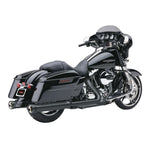 Two black cylindrical Cobra NH Slip-On Mufflers for 2017-Up Harley-Davidson Touring motorcycles, featuring silver inner rims and mounting brackets, are displayed diagonally against a white background—these performance exhaust pipes from Cobra are engineered to provide your Harley with bold sound and standout style.