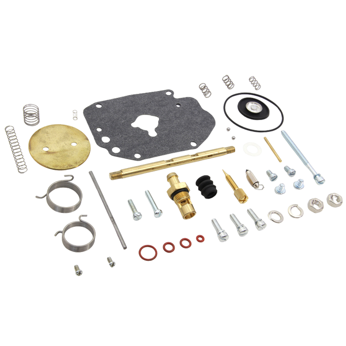 The Wyatt Gatling Master Rebuild Kit for Super E Carburetor by Wyatt Gatling includes assorted components such as gaskets, springs, bolts, washers, seals, and metal fittings arranged on a white background—ideal for restoring optimal Super E carburetor performance.