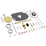 The Wyatt Gatling Master Rebuild Kit for Super E Carburetor by Wyatt Gatling includes assorted components such as gaskets, springs, bolts, washers, seals, and metal fittings arranged on a white background—ideal for restoring optimal Super E carburetor performance.