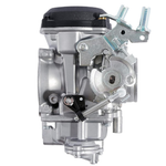 Two Moto Iron® CV Carburetors for Harley-Davidson are shown; one features a silver finish with visible springs and levers, evoking the style of classic Harley carburetors, while the other is black and equipped with sensors and attached cables. Both display intake and fuel control mechanisms.