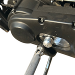 Close-up view of the TC Bros. Shifter Shaft Cover for Harley-Davidson Big Twin 1974-2017, shown with a textured foot peg and metal knob against a white background.