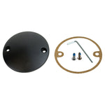 The Moto Iron® Black Points/Ignition Cover for Harley-Davidson 1970-2022 features a round black metal cover, circular gasket, two screws, and an L-shaped hex key—displayed side by side on a white background.