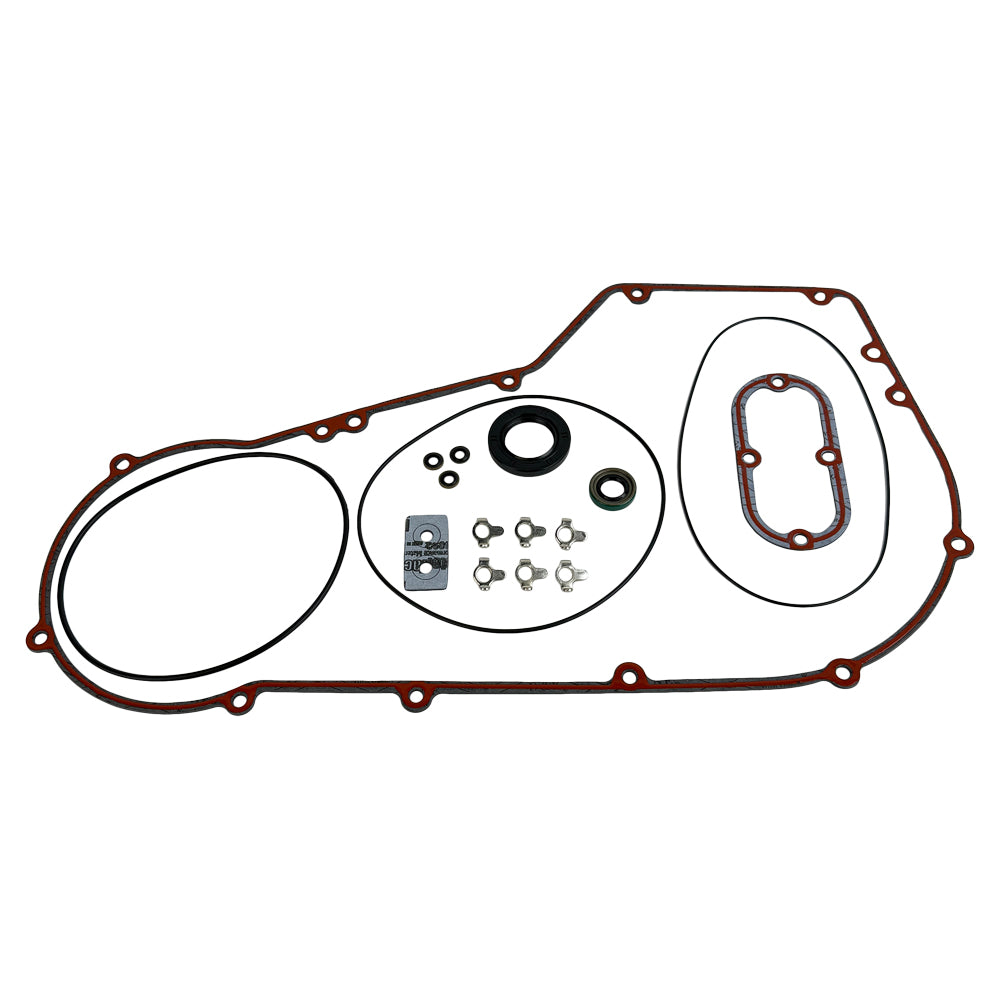 The Moto Iron® Complete Primary Gasket Kit for Harley-Davidson Dyna and Softail includes gaskets, seals, washers, and hardware, all neatly arranged on a white background.