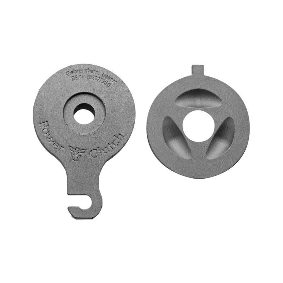 A pair of gray metal parts with a hole in the middle, ideal for the Muller Motorcycle AG Power Clutch For Harley Big Twin 1999-2021.